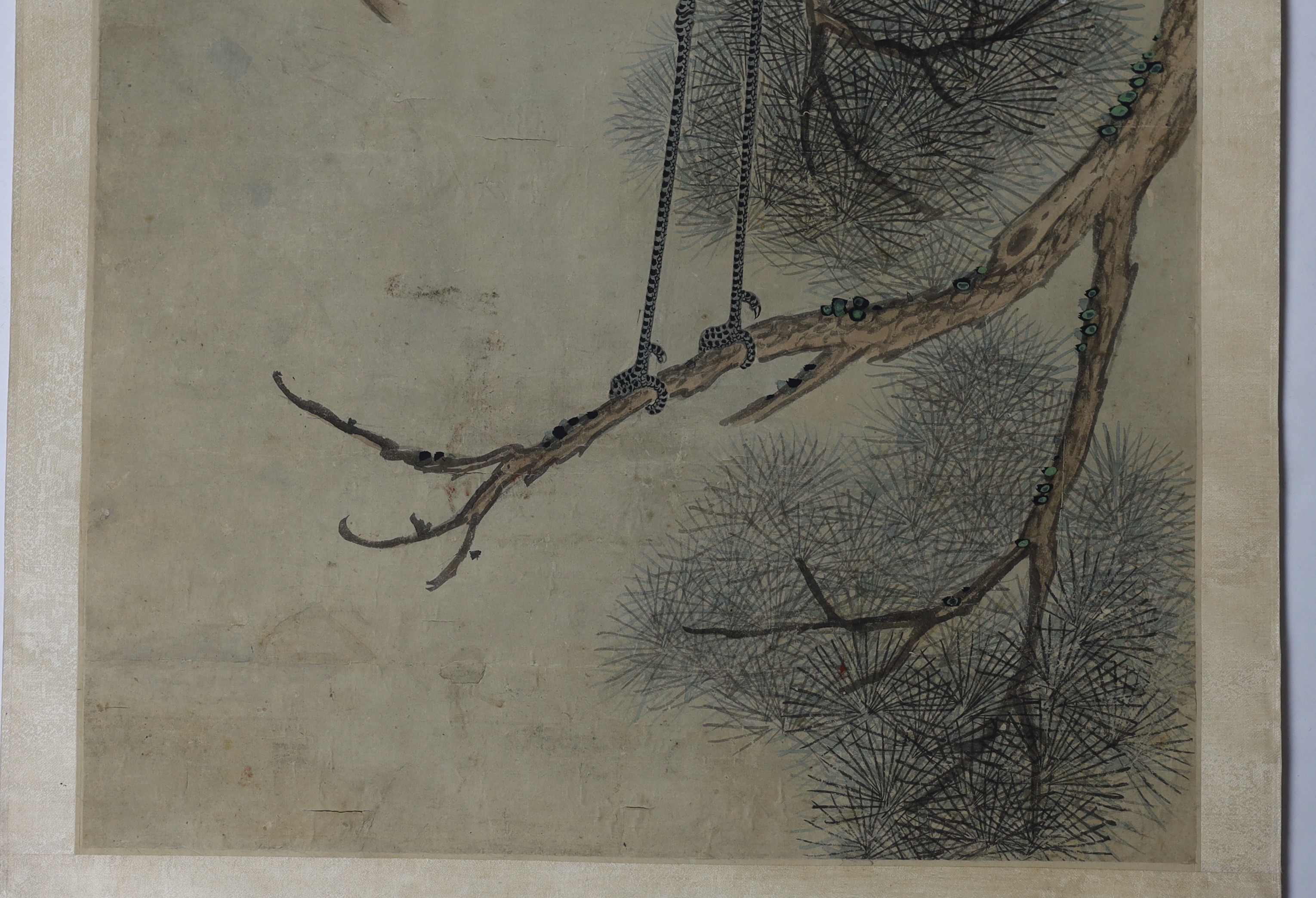 A Chinese scroll painting on paper of cranes perched in a pine tree, 19th century, image 163.5cm x 44cm